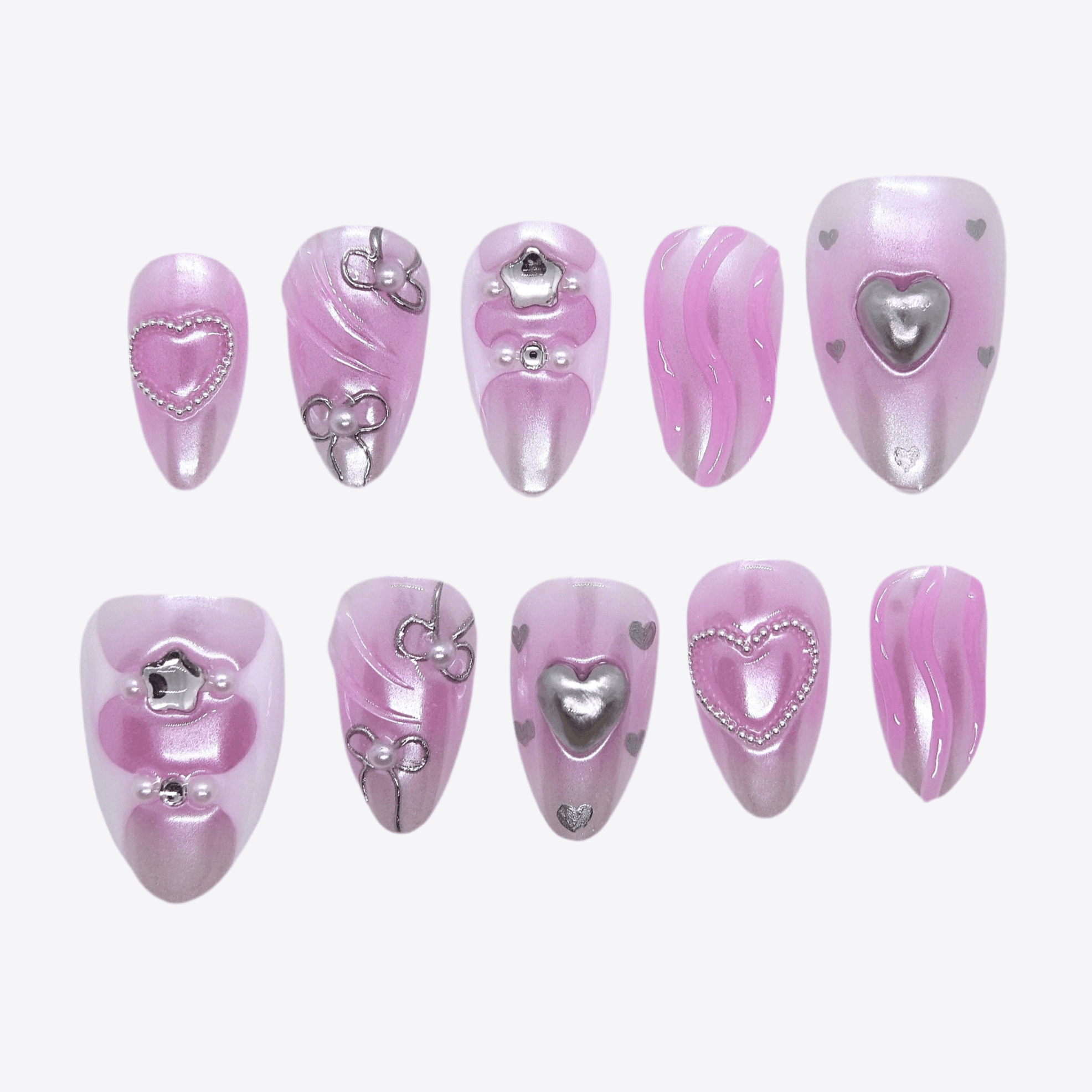 Glossy bubblegum pink press-on nails with silver heart details and chrome accents – full set view