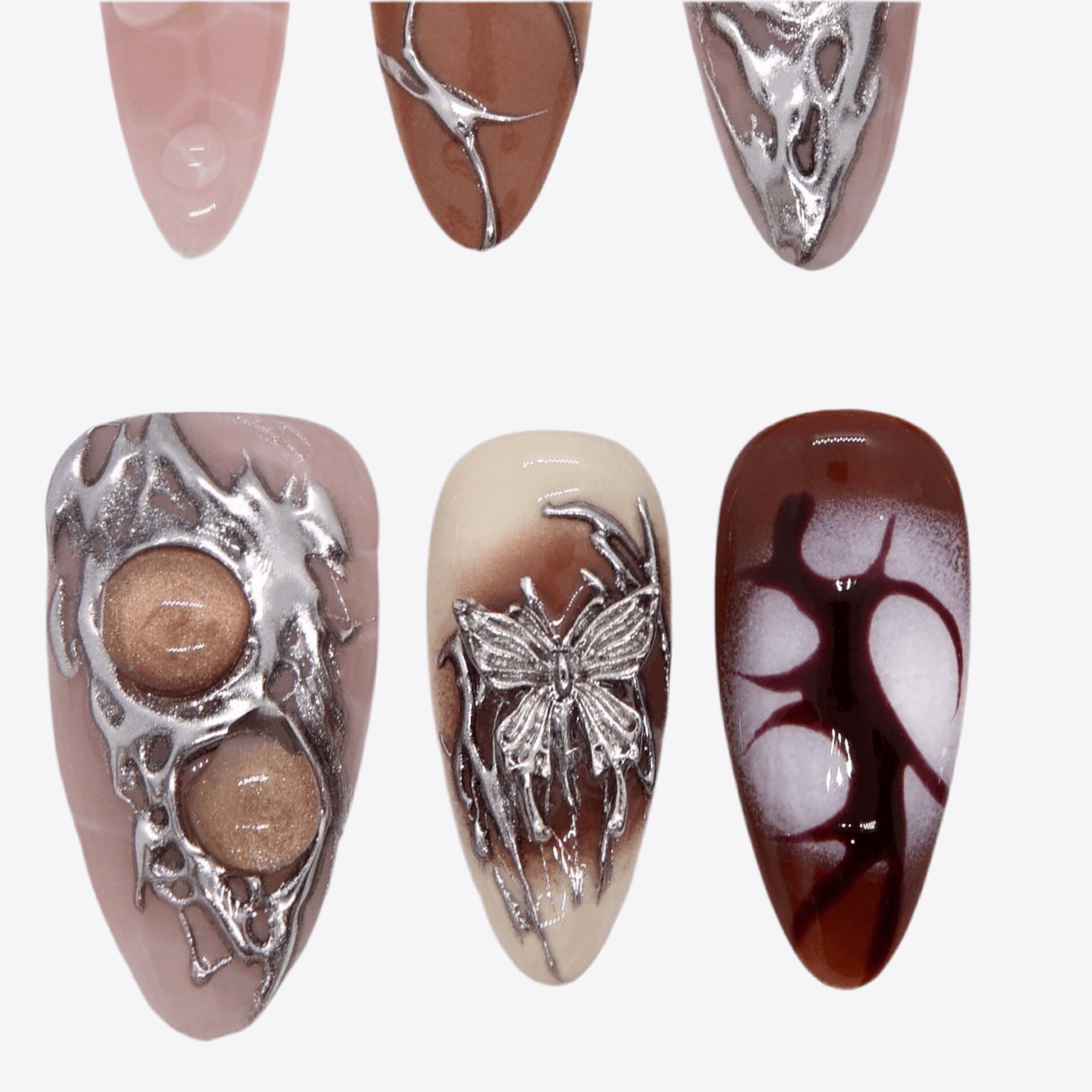 Cool Girl nail set with cracked pattern, chrome structures, and grunge details.