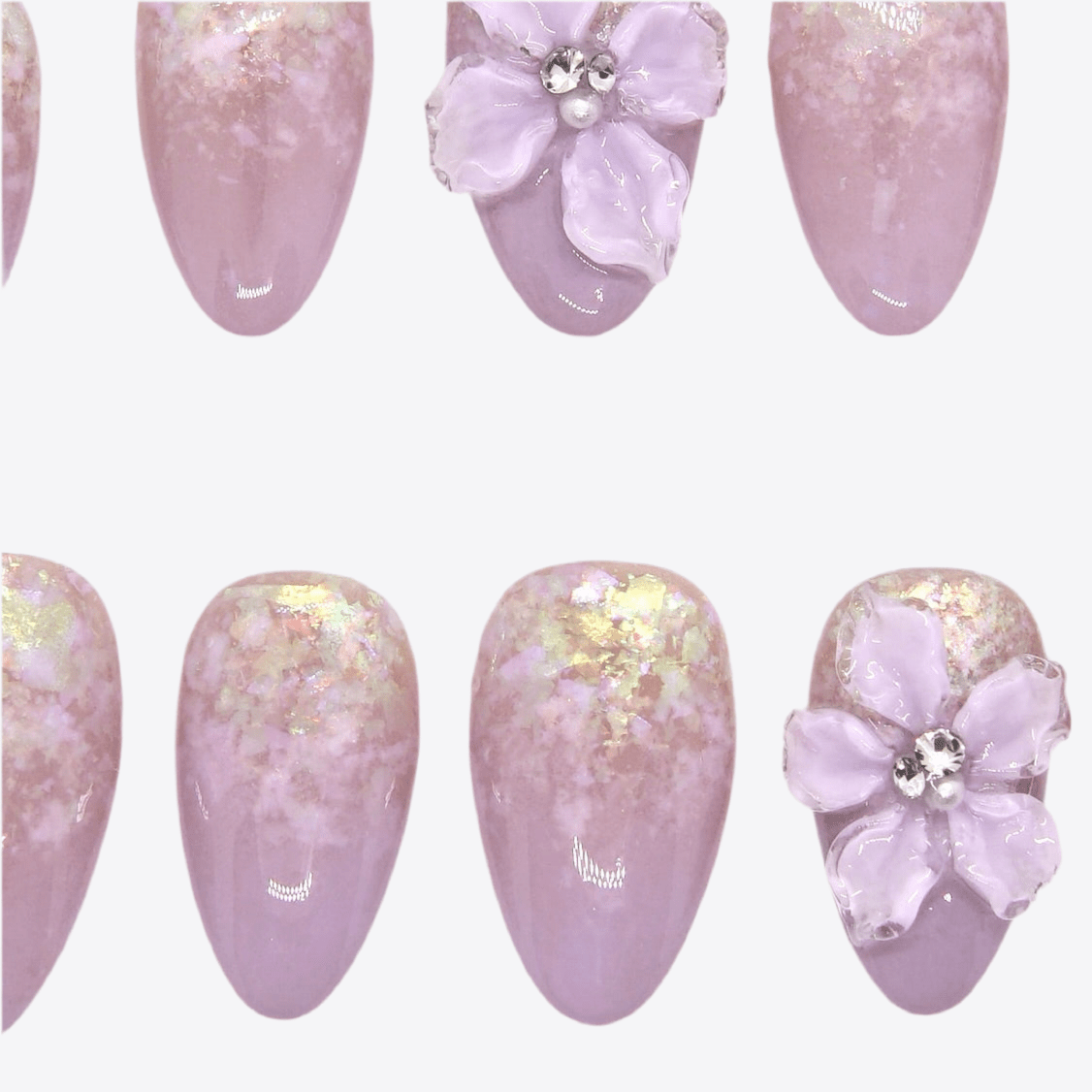 Detailed view of lavender ombré gradient with iridescent flakes on press-on nails.
