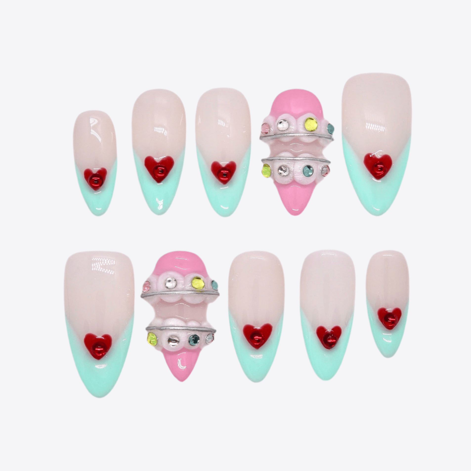 Pastel press-on nails with heart accents and brace-inspired 3D design.