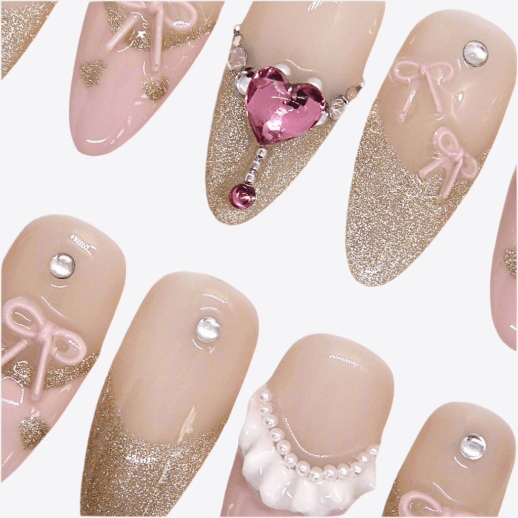 Close-up of handcrafted bow and crystal heart detail on Ribbon Agenda press-on nail design